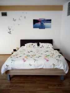 Кровать или кровати в номере Apartament Daniel