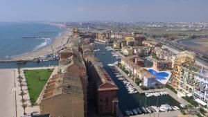 an aerial view of a city with a harbor at Sea You Apartamentos Valencia Port Saplaya in Port Saplaya