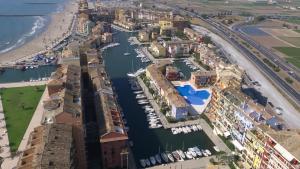 an aerial view of a harbor with boats in the water at Sea You Apartamentos Valencia Port Saplaya in Port Saplaya