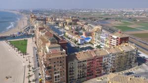 an aerial view of a city and the ocean at Sea You Apartamentos Valencia Port Saplaya in Port Saplaya