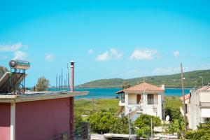 a view of the ocean from the roof of a building at Vasw Apartment in Ágios Nikólaos