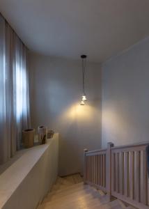 a room with a staircase and a light on the ceiling at OMM INN in Eskisehir