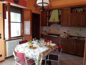 a kitchen with a table with a table cloth on it at Kevin House in Marlia +25 photos