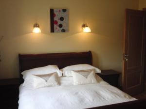 Postel nebo postele na pokoji v ubytování Woodlands House