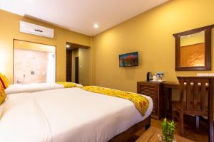 Letto o letti in una camera di Hotel Mala Pokhara