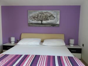 Posteľ alebo postele v izbe v ubytovaní Apartments Benic