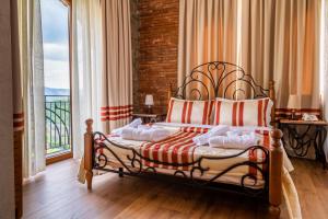 Postel nebo postele na pokoji v ubytování Hotel Restaurant Emblema