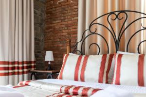 Postel nebo postele na pokoji v ubytování Hotel Restaurant Emblema