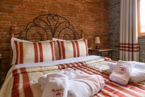 Postel nebo postele na pokoji v ubytování Hotel Restaurant Emblema