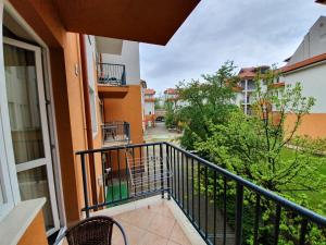 an apartment balcony with a view of a street at Baby Apartman in Hajdúszoboszló