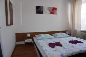 A bed or beds in a room at Hotel Guľa