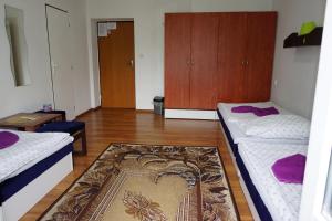A bed or beds in a room at Hotel Guľa