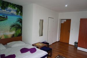 A bed or beds in a room at Hotel Guľa