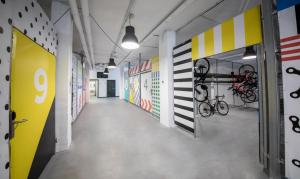 a hallway in an office building with colorful walls at Hotel Cap Negret in Altea