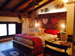Postel nebo postele na pokoji v ubytování B&B Relais Cascina al Campaccio