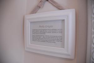 a picture of a picture frame hanging on a wall at Romantic Home in Sirmione