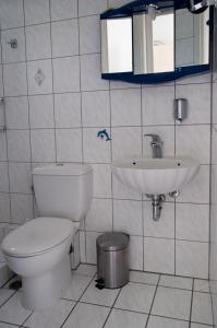 a bathroom with a toilet and a sink at Hara's Studio in Perdika