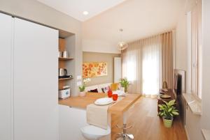 a living room with a couch and a table at Suite Manin in Treviso