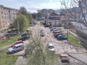 a group of cars parked in a parking lot at Apartament Anita in Vulcan