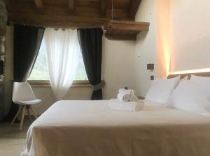 Postel nebo postele na pokoji v ubytování B&B Lo Matsòn