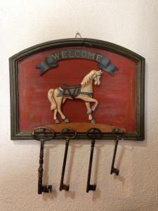 a painting of a horse and a cow on a wall at Hotel Triolet in Courmayeur