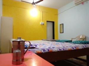 Postel nebo postele na pokoji v ubytování Hotel Anjali Lodge Malvan