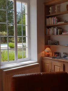 a living room with a window and a couch at la blanchetière in Francueil