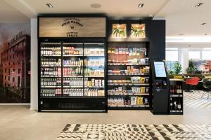 a store with a large amount of products on display at Leonardo Hotel Rotterdam Savoy in Rotterdam