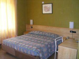 Cama o camas de una habitación en Hotel Milano