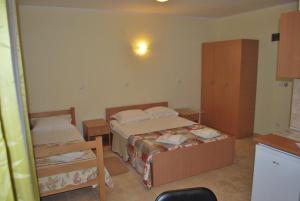 Ένα ή περισσότερα κρεβάτια σε δωμάτιο στο Prenoćište Leona