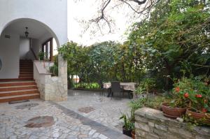 a courtyard of a house with a table and chairs at Big Dream 2 in Rovinj