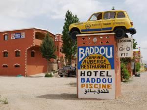 a sign with a truck on top of it at Hotel Baddou in Tamtetoucht