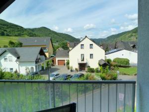 a view from a balcony of a house and a yard at Gästehaus Bleser in Ernst