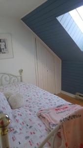 Кровать или кровати в номере La Maison du Village