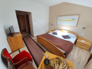Postel nebo postele na pokoji v ubytování Restaurant and rooms Kotlar
