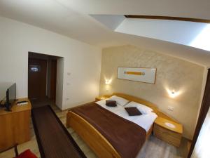 Postel nebo postele na pokoji v ubytování Restaurant and rooms Kotlar