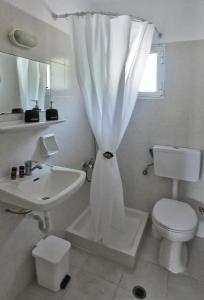 Ванная комната в Su Casa Apartments +64 фотографии