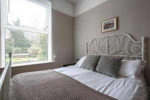 Łóżko lub łóżka w pokoju w obiekcie Baytree Lodge Chester