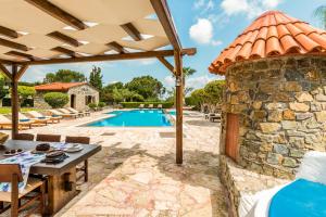 an external view of a villa with a pool at Oceanides Luxury Apartments in Sitia