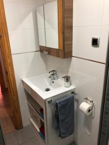 a bathroom with a sink and a mirror at Apartamentos casa Tia Antonia in Málaga +37 photos