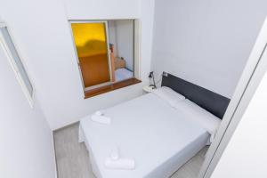 Posteľ alebo postele v izbe v ubytovaní HomeHolidaysRentals Vall III