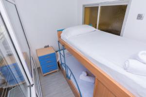 Posteľ alebo postele v izbe v ubytovaní HomeHolidaysRentals Vall III