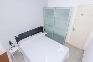 Posteľ alebo postele v izbe v ubytovaní HomeHolidaysRentals Vall III