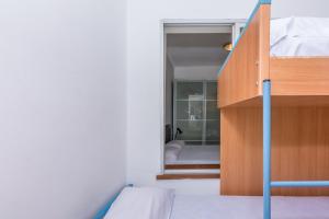 Posteľ alebo postele v izbe v ubytovaní HomeHolidaysRentals Vall III