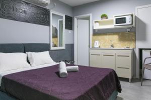 Cama o camas de una habitación en Rich Luxury Suites