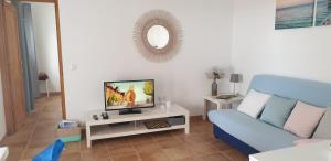 TV a/nebo společenská místnost v ubytování Casa Filale Sun and Relax