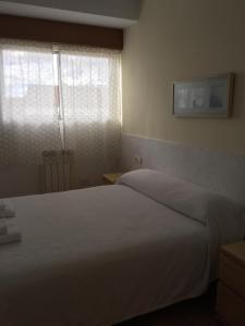 Posteľ alebo postele v izbe v ubytovaní Apartamento Vacacional do Pexigo