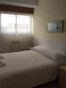 Posteľ alebo postele v izbe v ubytovaní Apartamento Vacacional do Pexigo