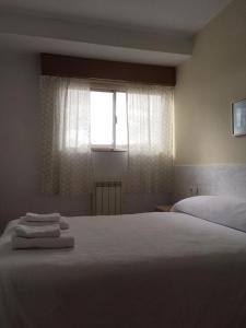 Posteľ alebo postele v izbe v ubytovaní Apartamento Vacacional do Pexigo