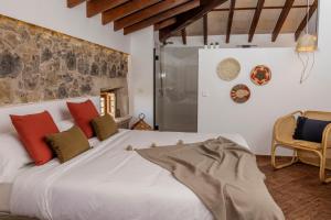 Łóżko lub łóżka w pokoju w obiekcie Curolla Petit Hotel